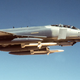 An F-4G “Wild Weasel” from the US Air Force 35th Tactical Fighter Wing armed with AGM-88 high speed anti-radiation missies flies over the Saudi desert Operation Desert Shield in January 1991. (US Air Force)